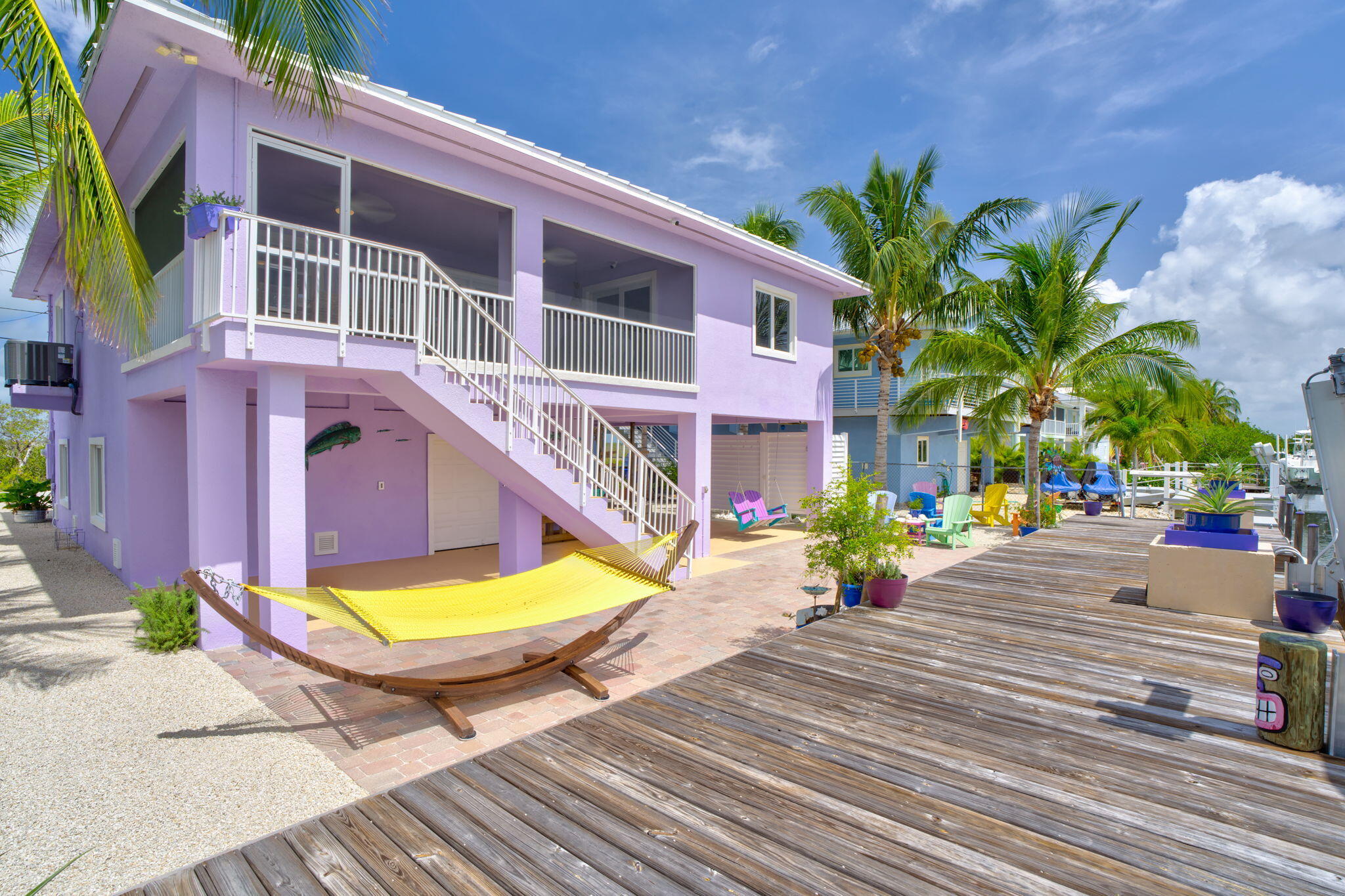 823 Indies Road Summerland Key, FL 33042 - Photo 32 of 48 a view of a swimming pool with a lounge chairs