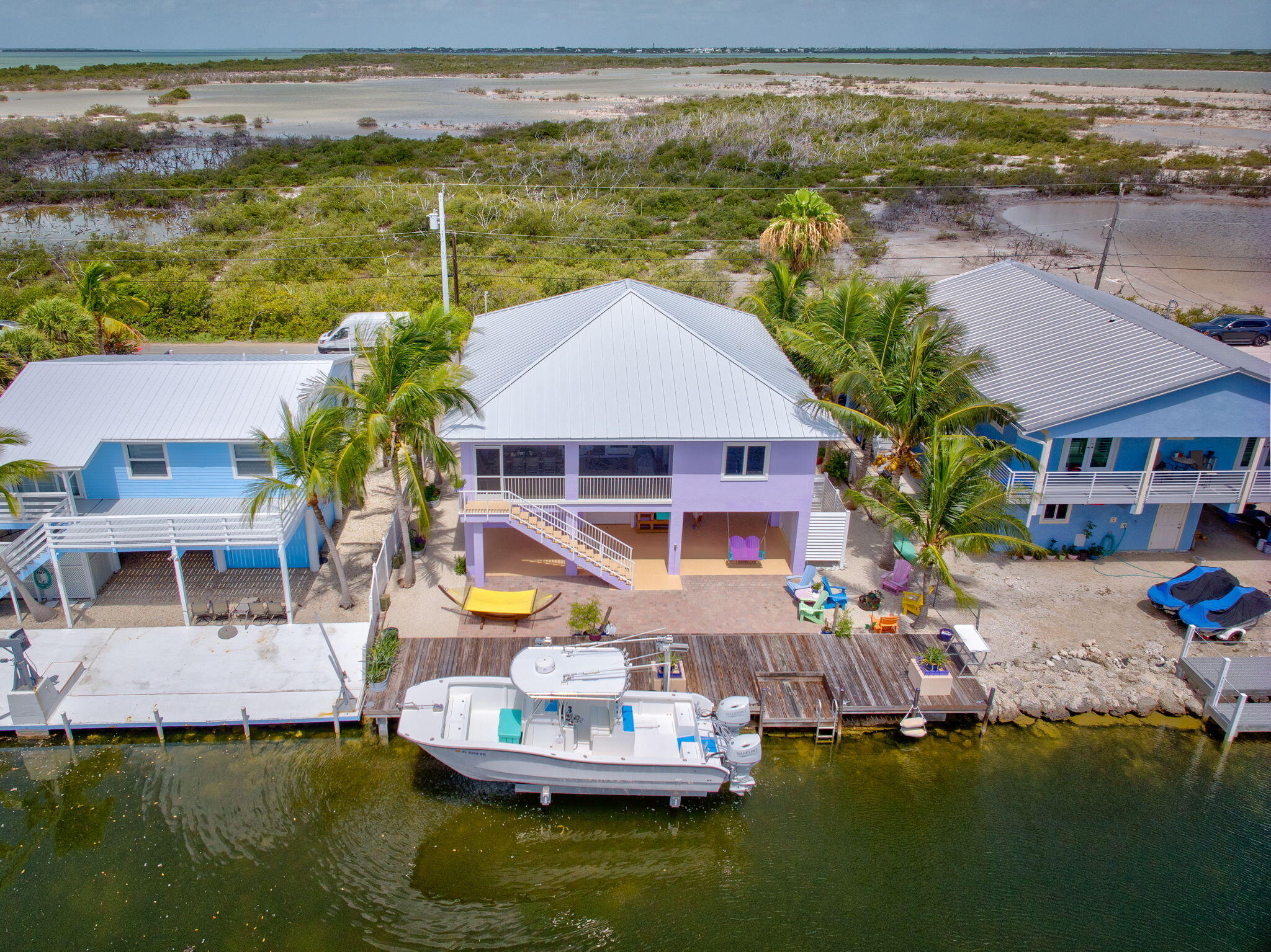 823 Indies Road Summerland Key, FL 33042 - Photo 44 of 48 a aerial view of a house with swimming pool lawn chairs and a yard