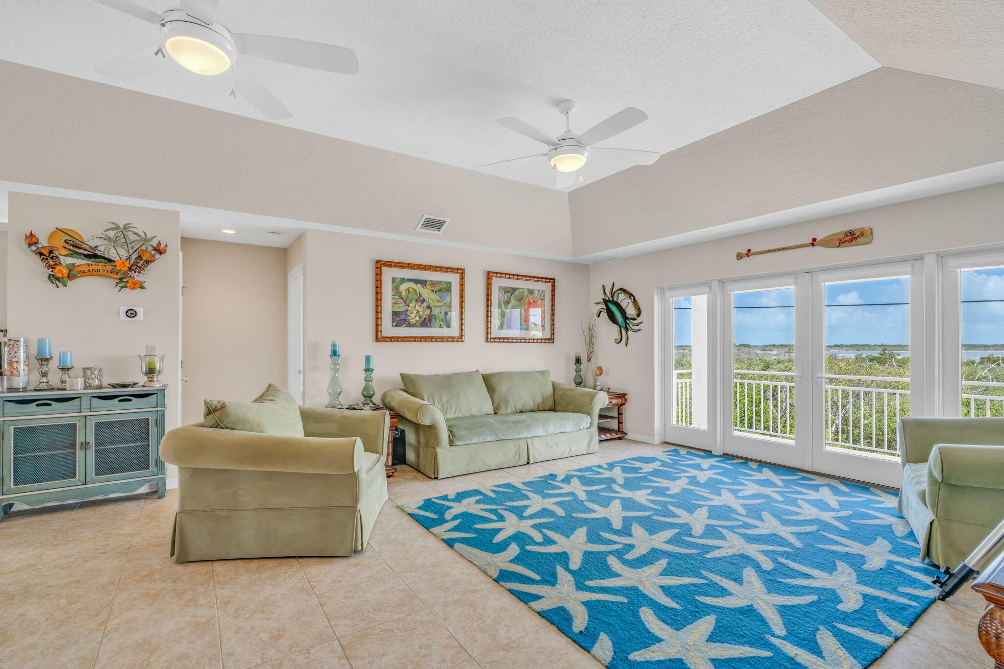 823 Indies Road Summerland Key, FL 33042 - Photo 7 of 48 a living room with furniture and a floor to ceiling window