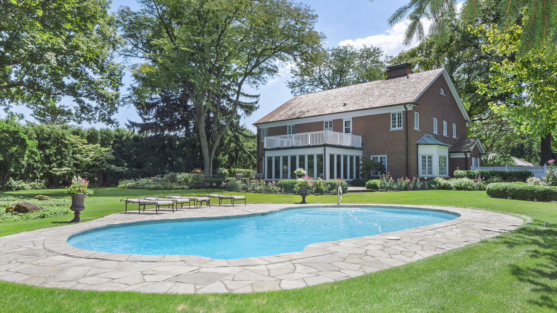 109 Woodley Road Winnetka, IL 60093 - Photo 2 of 24 a view of a house with a yard and sitting area