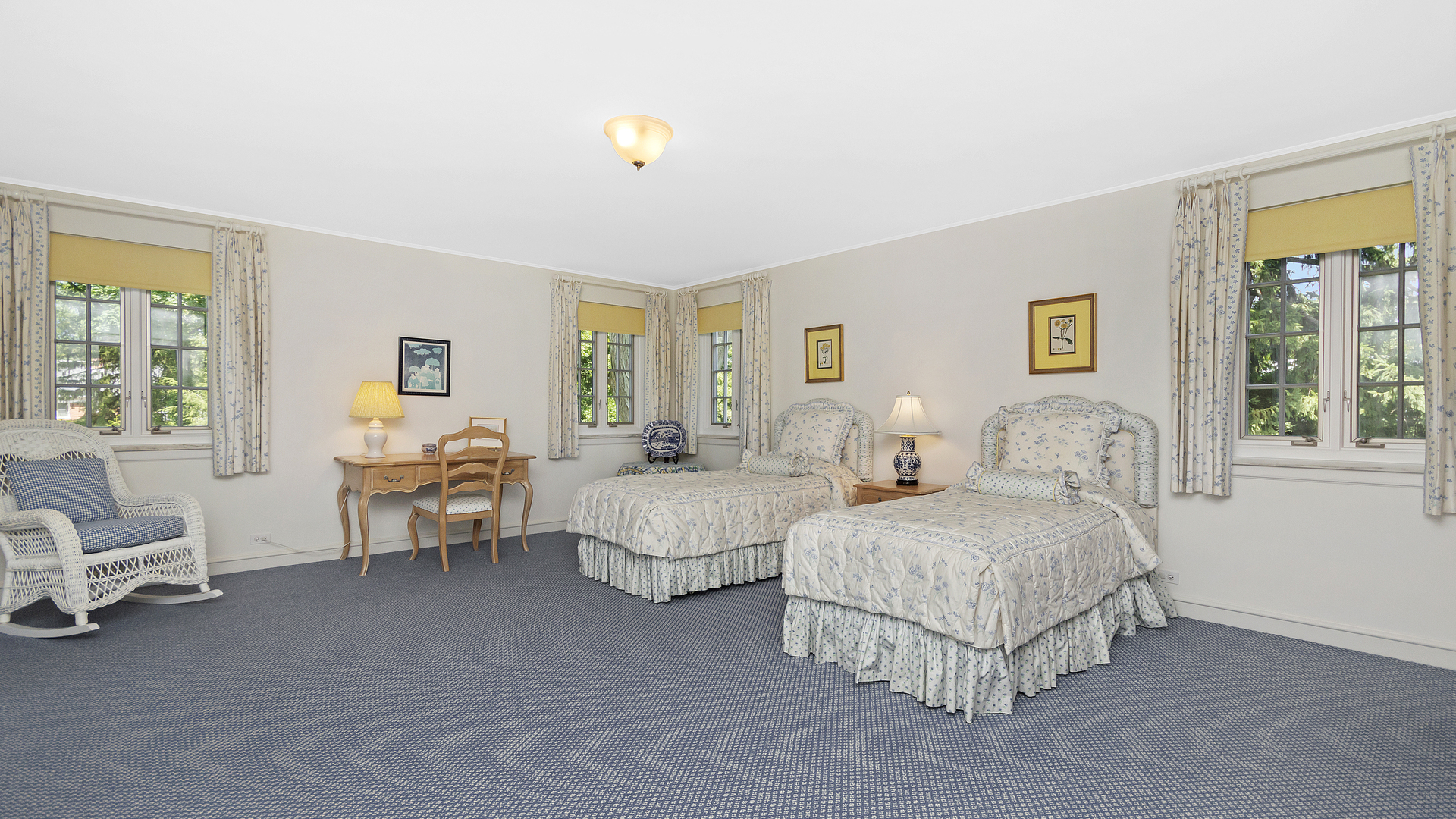 109 Woodley Road Winnetka, IL 60093 - Photo 15 of 24 a spacious bedroom with two beds and large windows