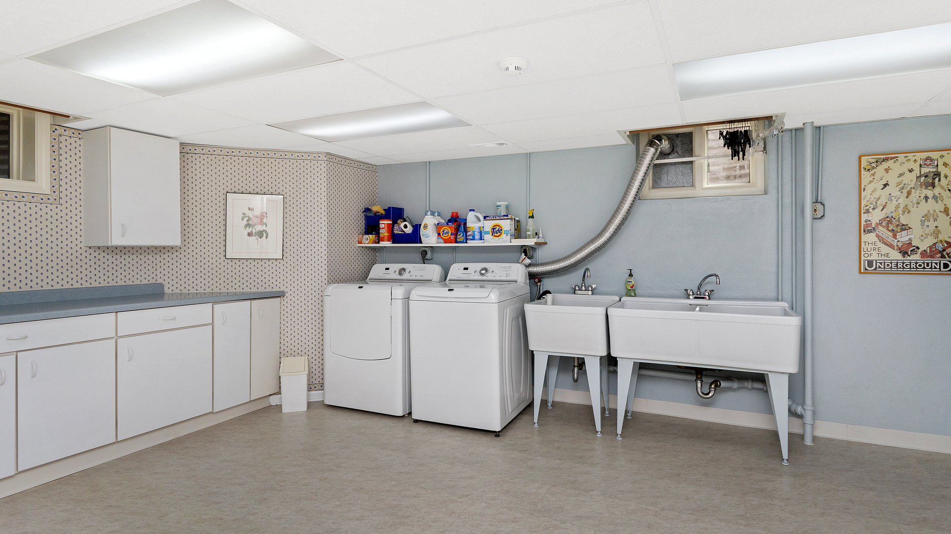109 Woodley Road Winnetka, IL 60093 - Photo 21 of 24 a utility room with cabinets dryer and washer