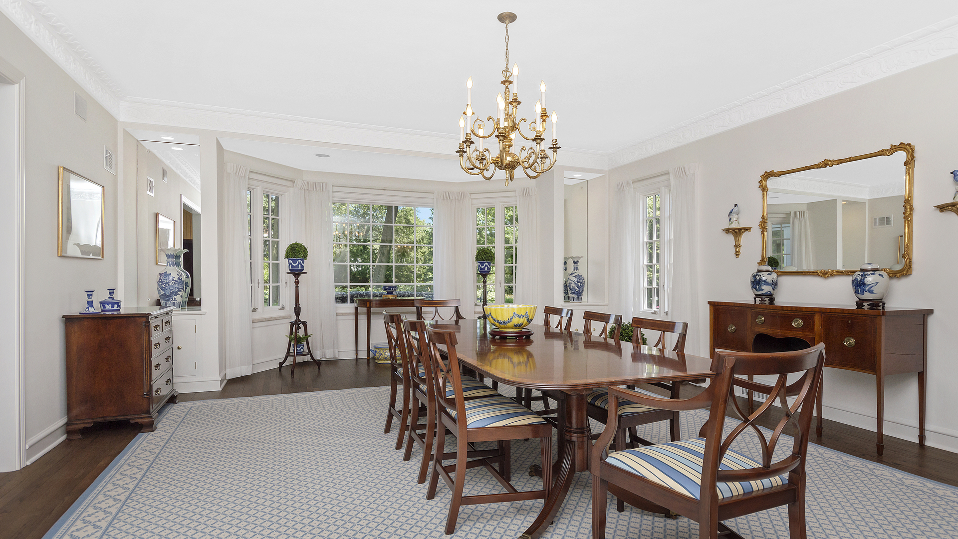 109 Woodley Road Winnetka, IL 60093 - Photo 6 of 24 a view of a dining room with furniture window and wooden floor