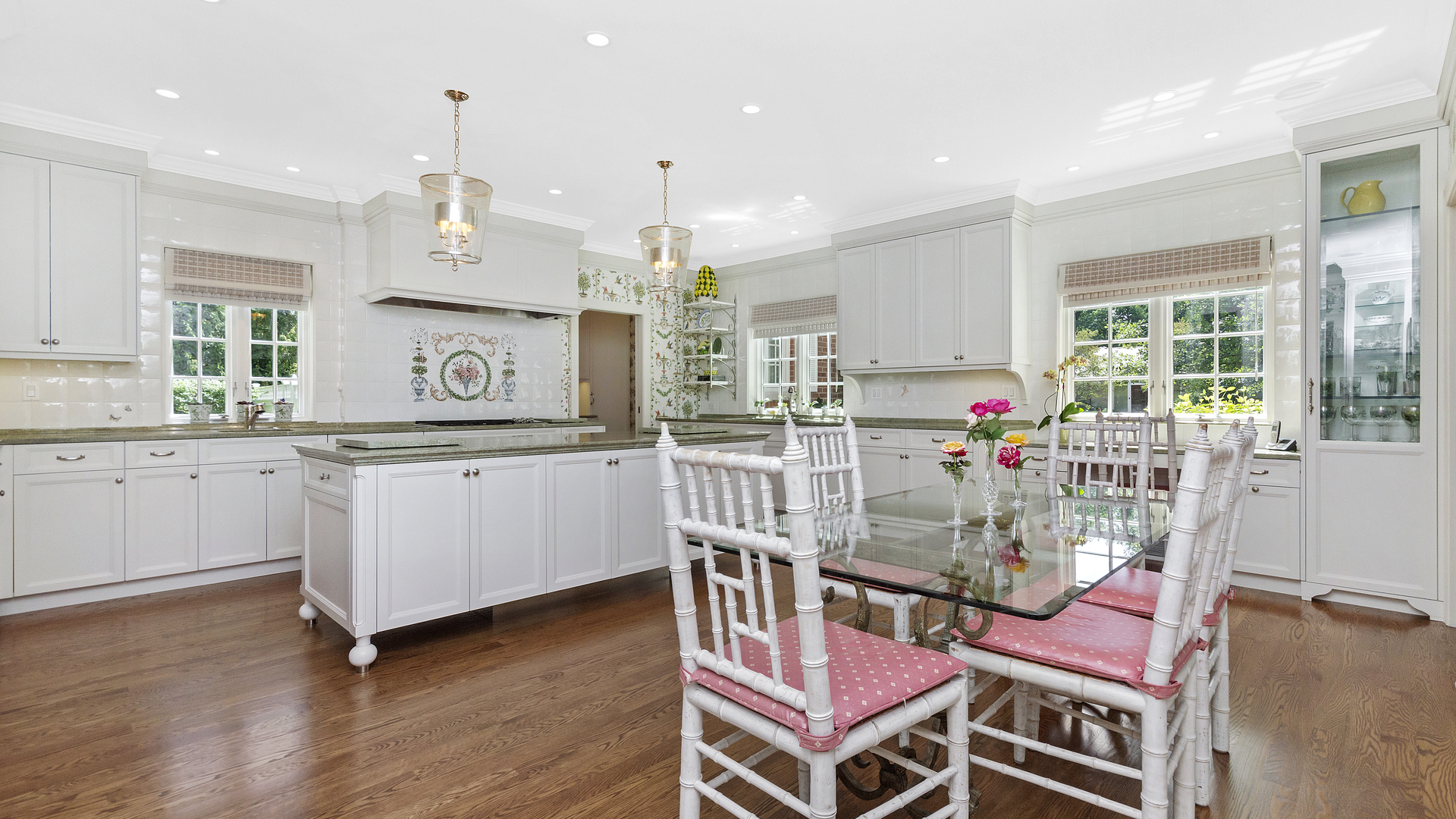 109 Woodley Road Winnetka, IL 60093 - Photo 8 of 24 a kitchen with granite countertop a stove a sink and a refrigerator