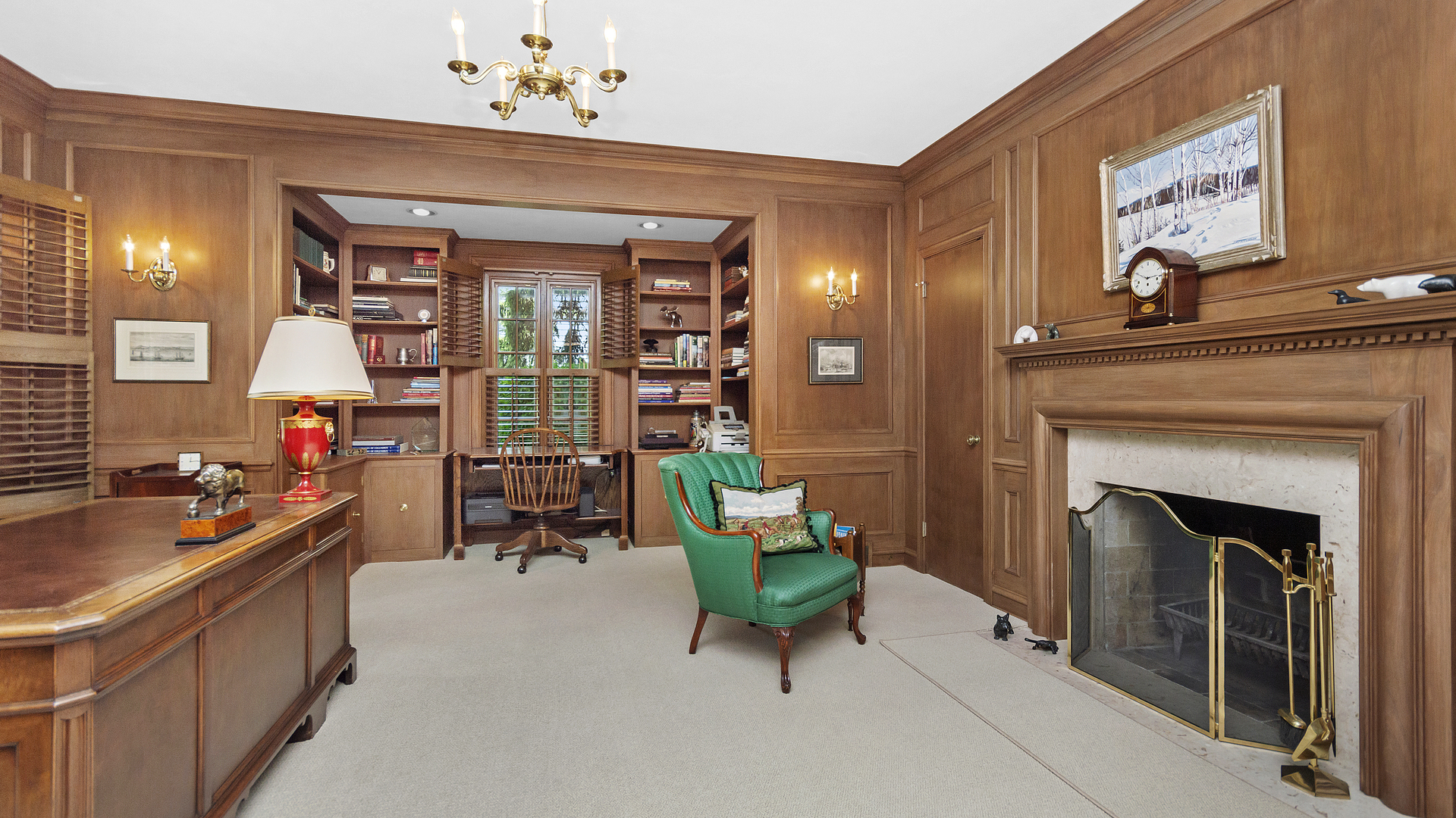 109 Woodley Road Winnetka, IL 60093 - Photo 9 of 24 a living room with furniture and a fireplace