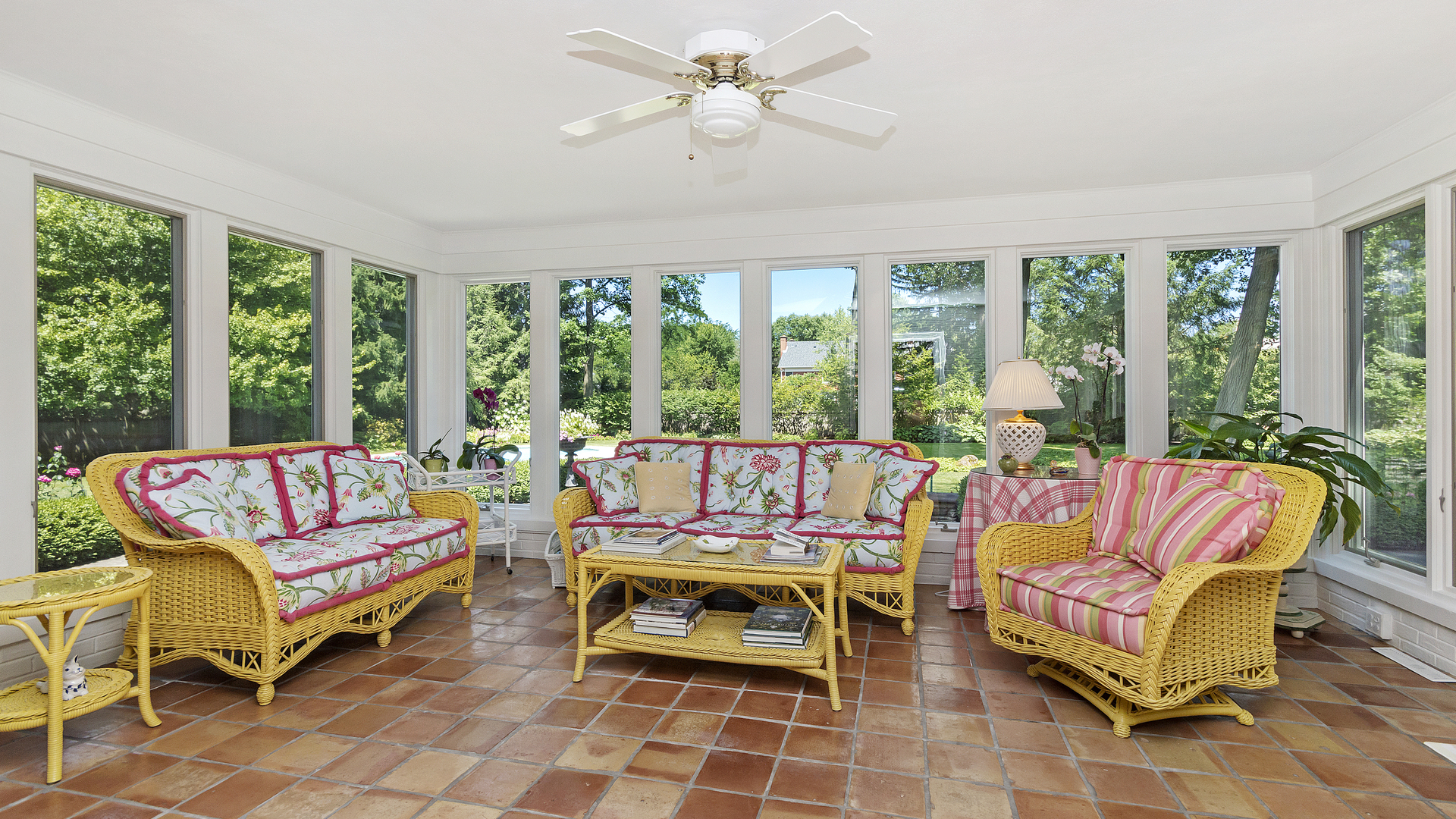 109 Woodley Road Winnetka, IL 60093 - Photo 10 of 24 a living room with furniture a rug potted plant and a large window