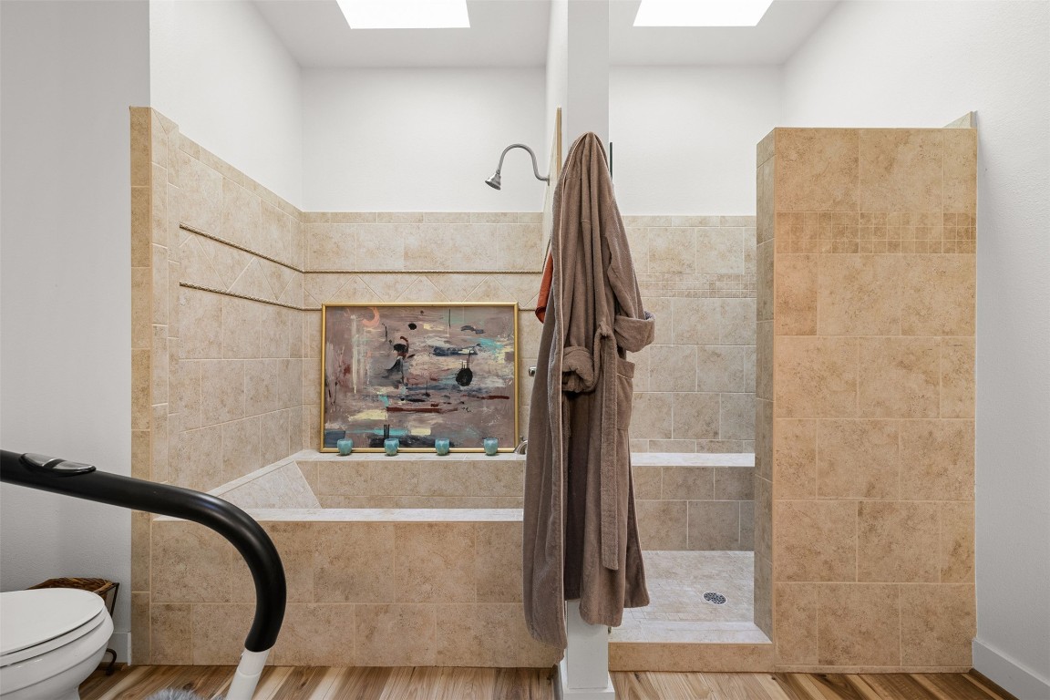 235 Floyd Lane Round Top, TX 78954 - Photo 12 of 19 a bathroom with a bathtub and a shower