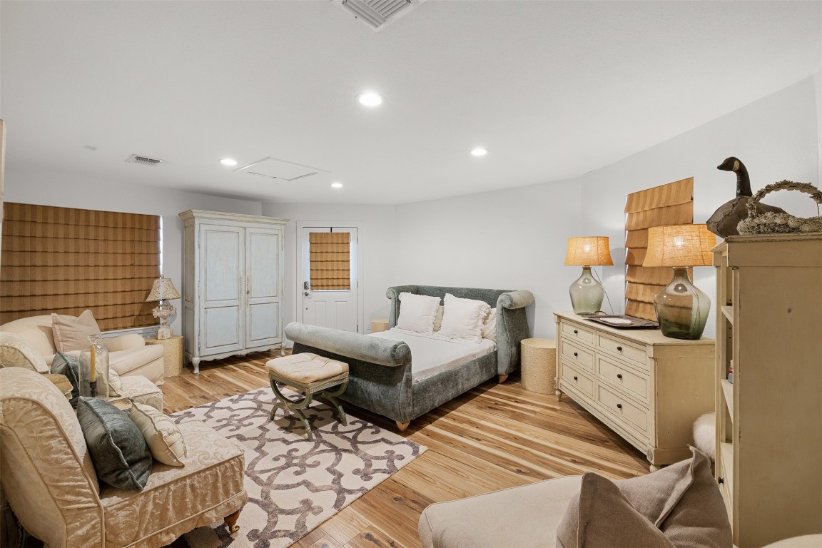235 Floyd Lane Round Top, TX 78954 - Photo 15 of 19 a spacious bedroom with a bed and a couch