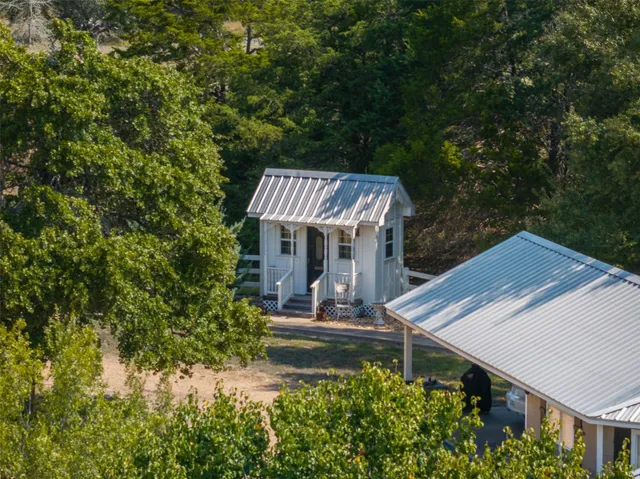 a view of house with outdoor space and sitting area