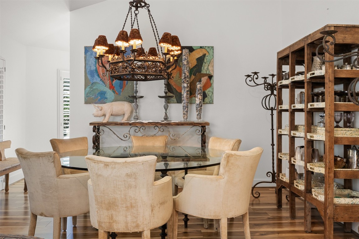 235 Floyd Lane Round Top, TX 78954 - Photo 6 of 19 a view of a dining room with furniture and wooden floor