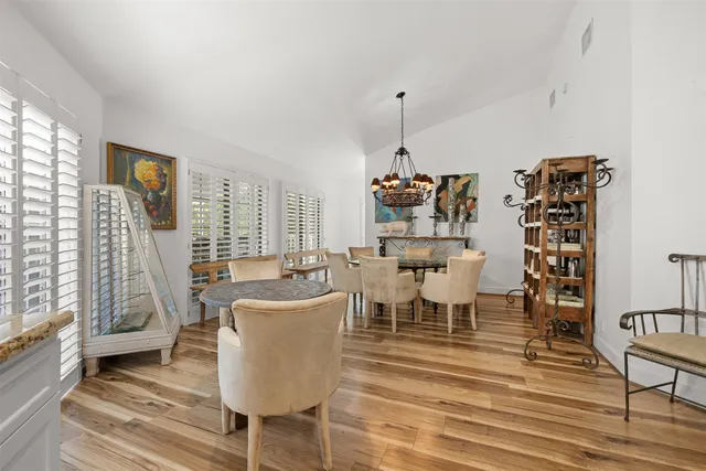 a living room with lots of furniture and a wooden floor