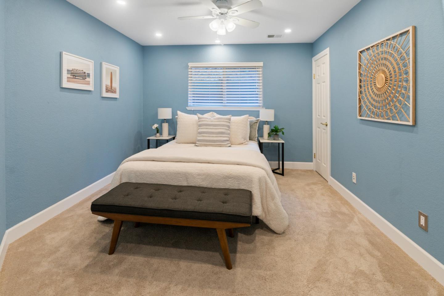 112 Alto Sol Court Scotts Valley, CA 95066 - Photo 15 of 58 a bedroom with a bed and a painting on the wall