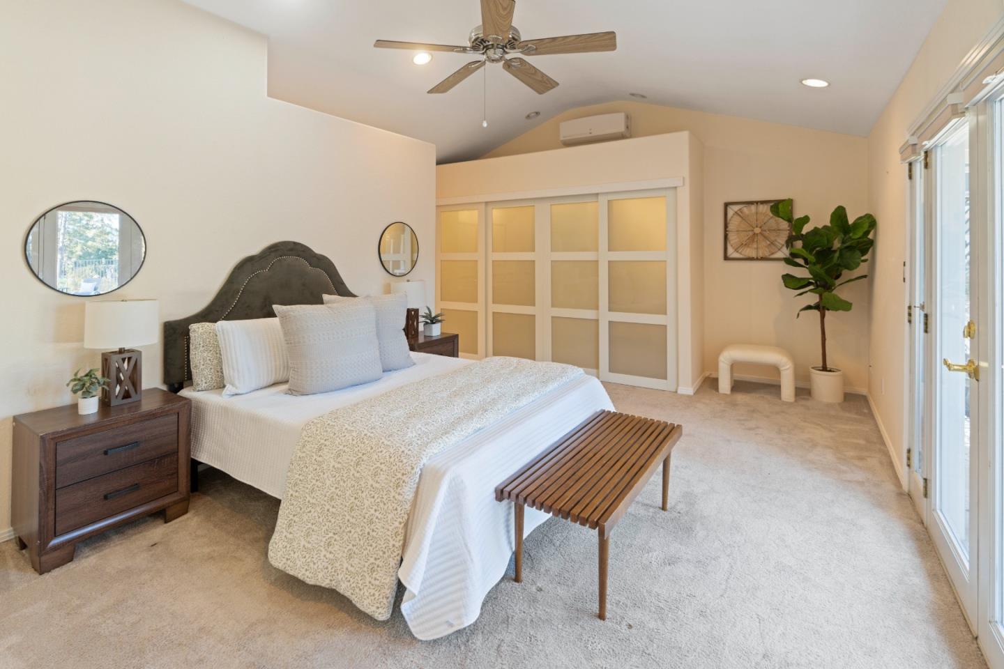 112 Alto Sol Court Scotts Valley, CA 95066 - Photo 18 of 58 a spacious bedroom with a bed and a table in it