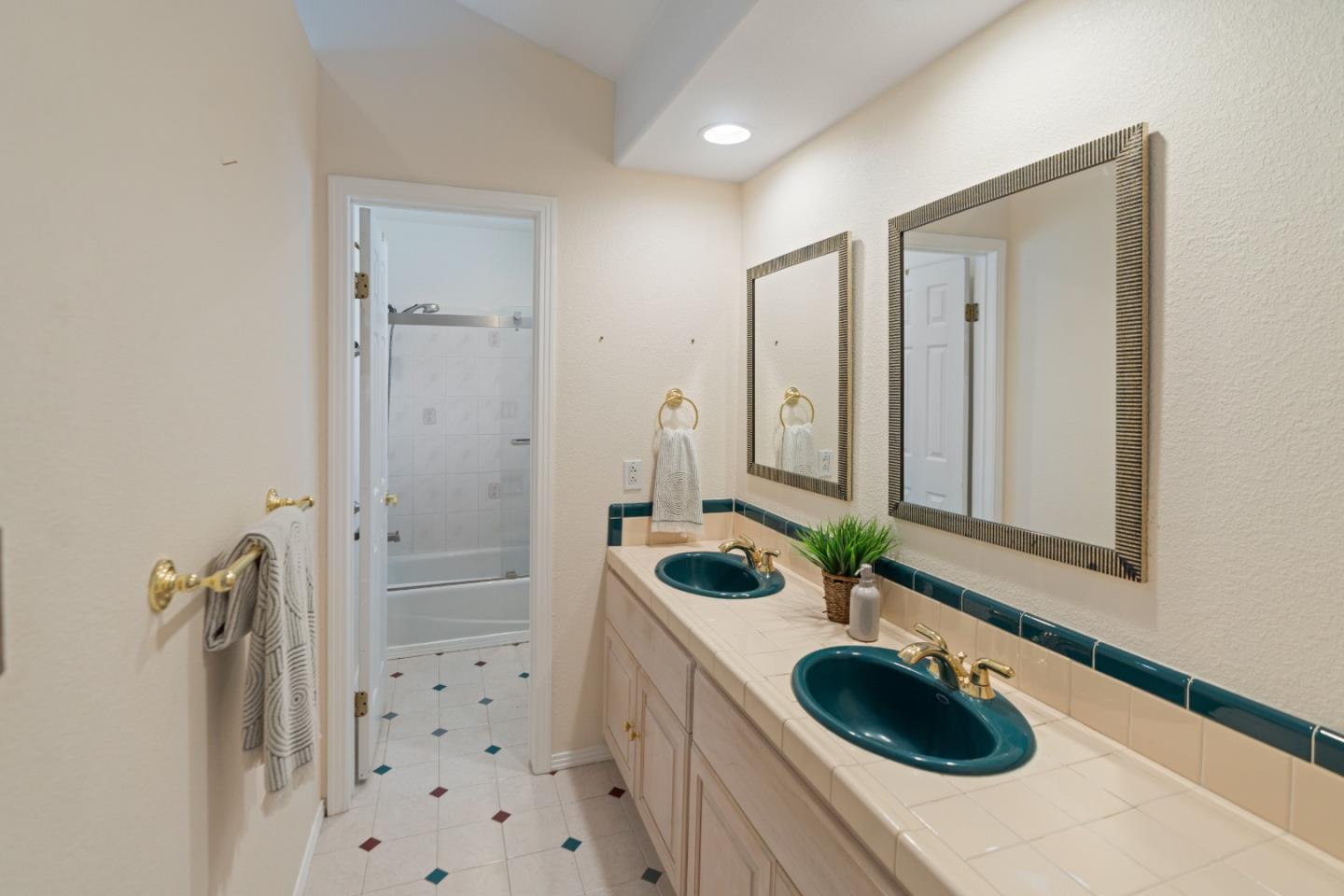 112 Alto Sol Court Scotts Valley, CA 95066 - Photo 20 of 58 a bathroom with a sink and a mirror