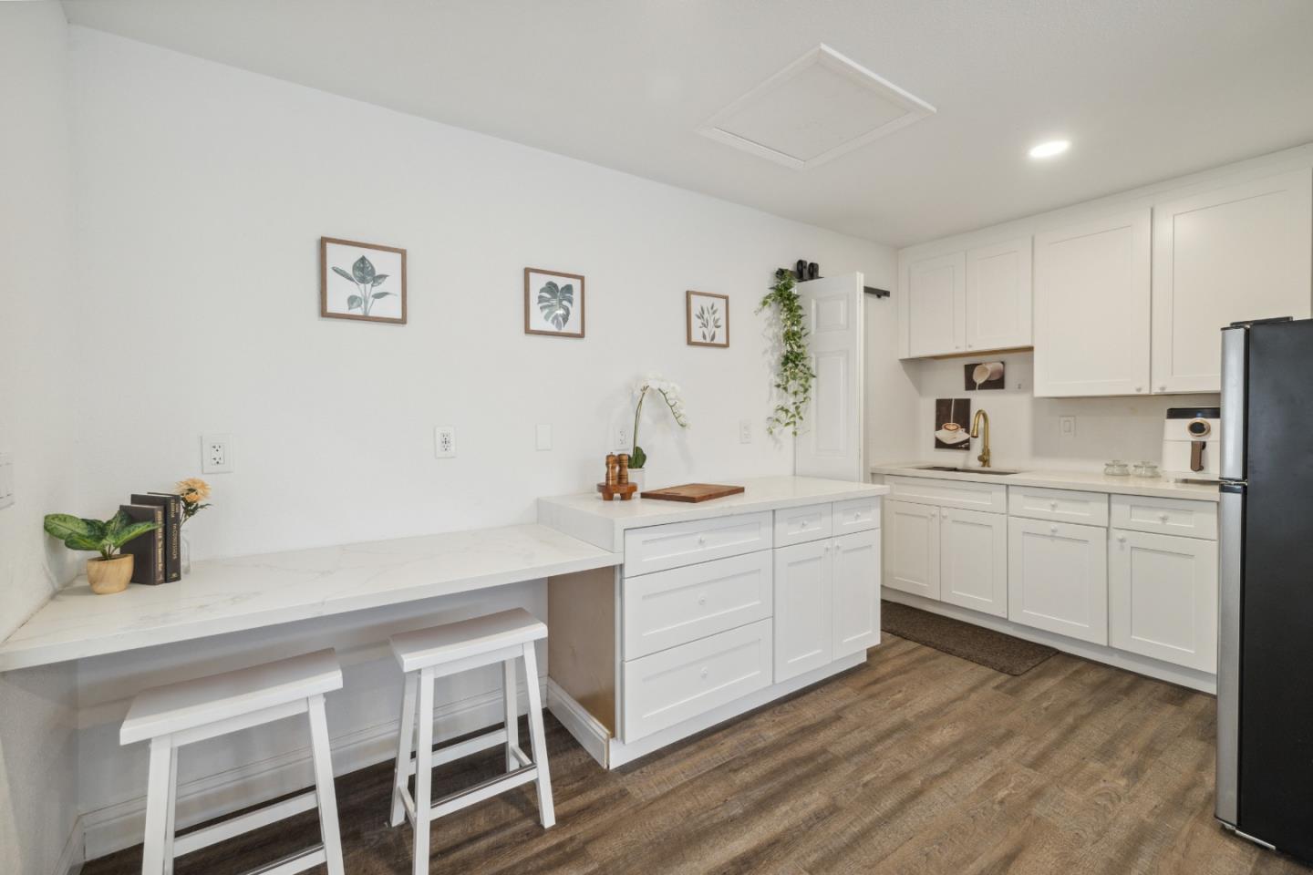 112 Alto Sol Court Scotts Valley, CA 95066 - Photo 36 of 58 a kitchen with white cabinets and white appliances