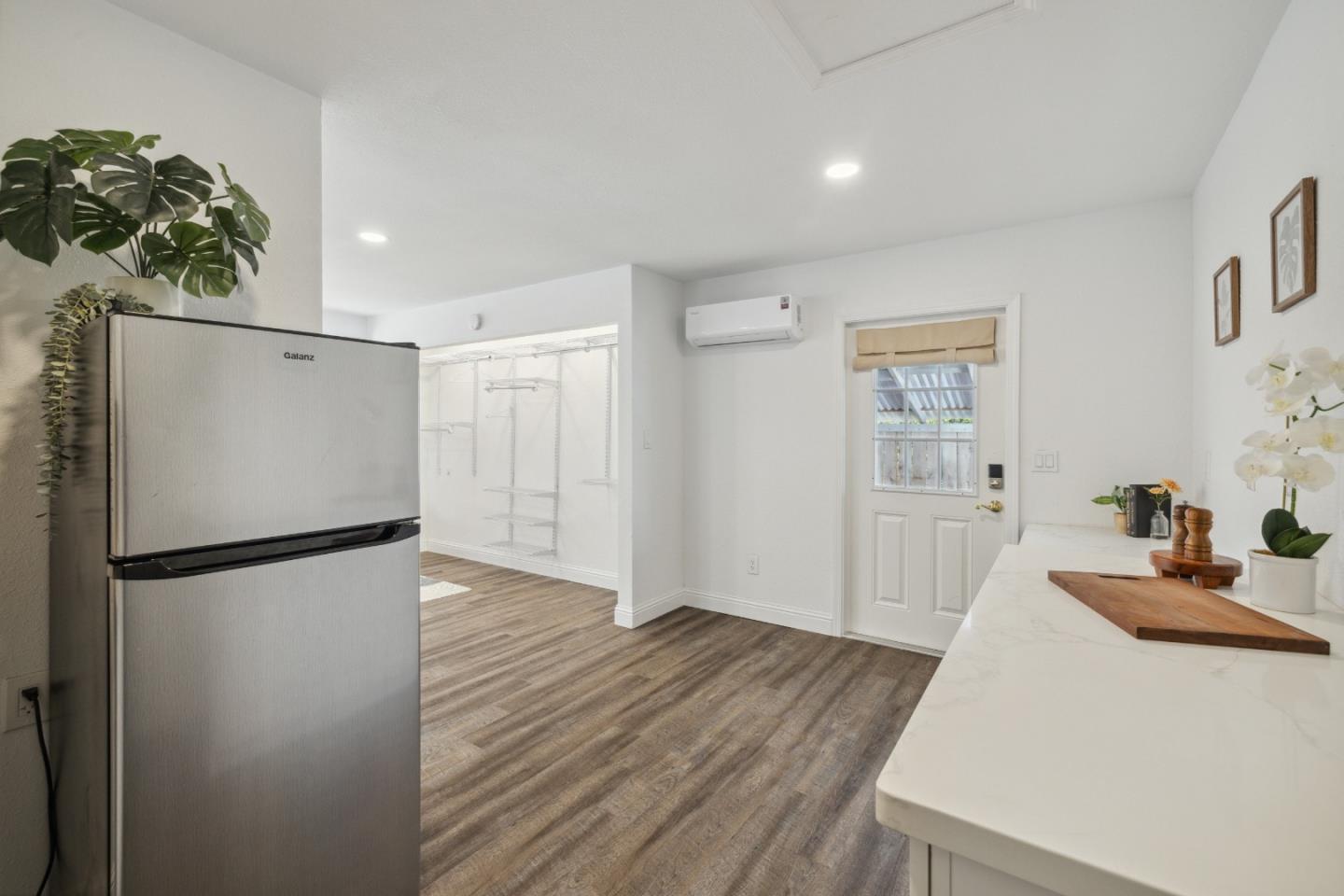 112 Alto Sol Court Scotts Valley, CA 95066 - Photo 37 of 58 a kitchen with a refrigerator and a hallway