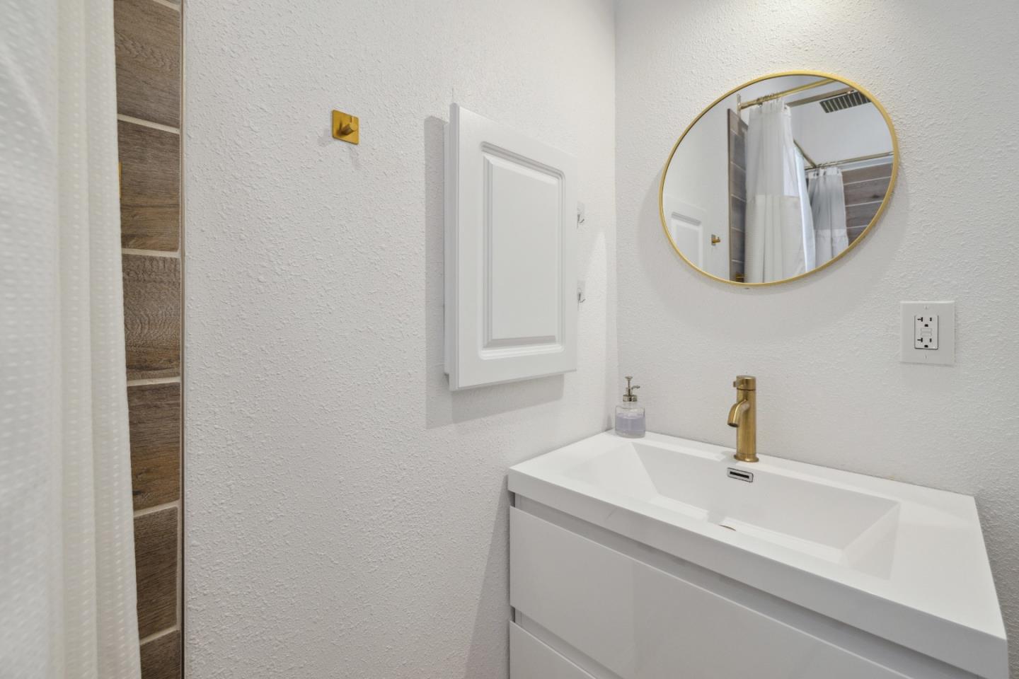 112 Alto Sol Court Scotts Valley, CA 95066 - Photo 38 of 58 a bathroom with a sink and a mirror