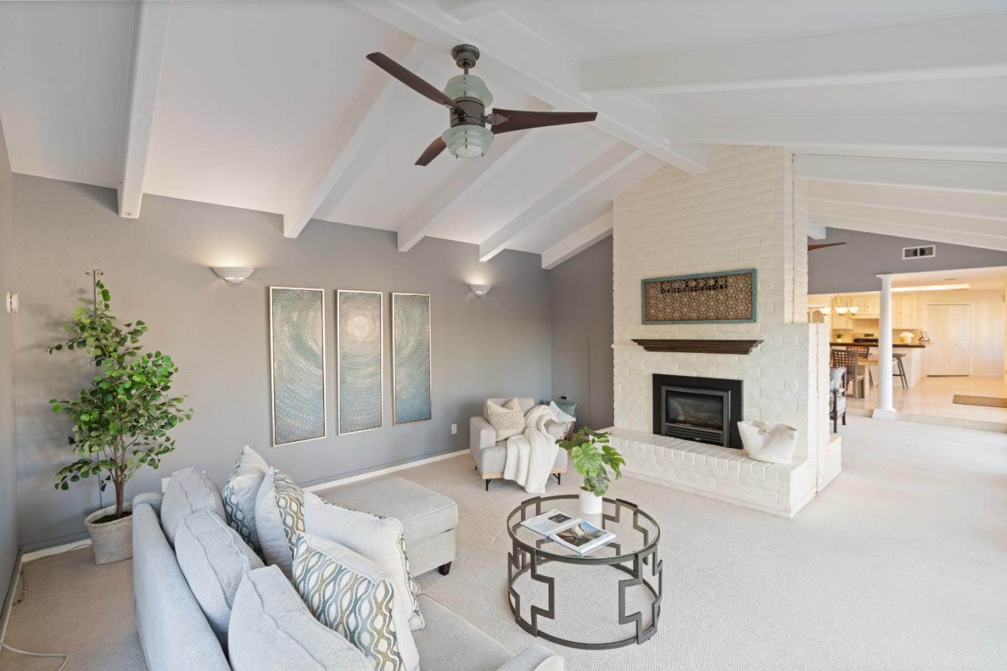 112 Alto Sol Court Scotts Valley, CA 95066 - Photo 6 of 58 a living room with furniture a fireplace and a potted plant