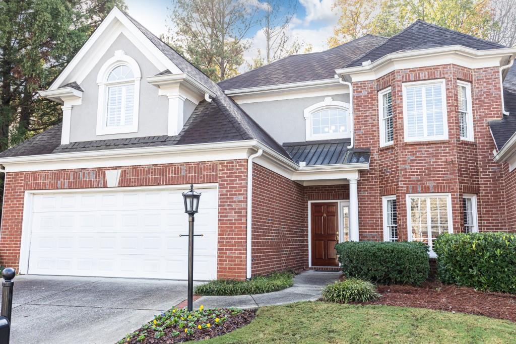 424 Brookview Circle Sandy Springs, GA 30339 - Photo 1 of 1 a front view of a house with garden