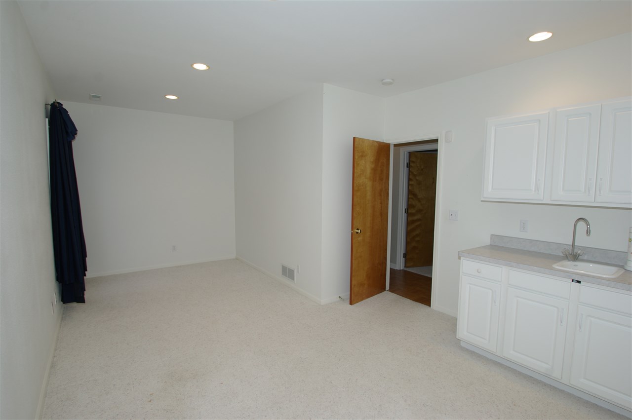 781 Timber Ridge Trail Rockford, IL 61114 - Photo 15 of 24 a view of a kitchen with a sink and a refrigerator