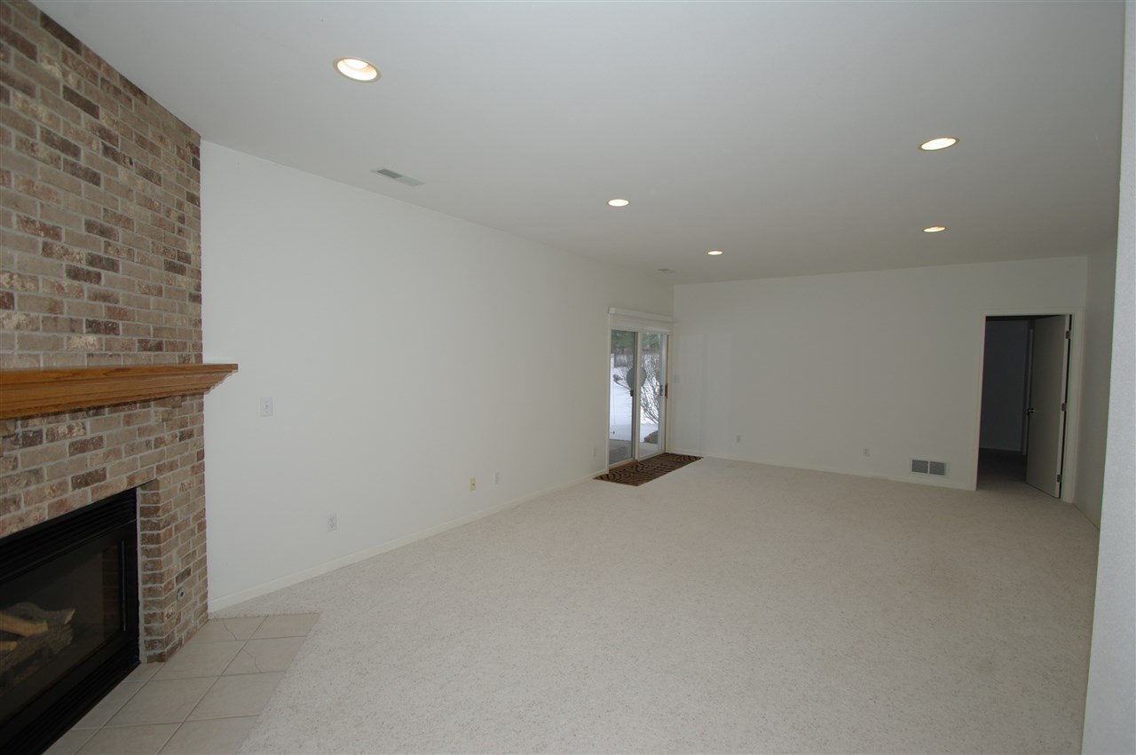 781 Timber Ridge Trail Rockford, IL 61114 - Photo 16 of 24 a view of empty room with a fireplace
