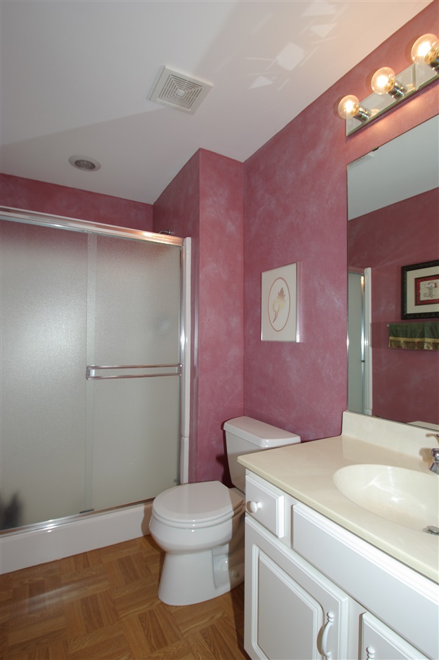781 Timber Ridge Trail Rockford, IL 61114 - Photo 20 of 24 a bathroom with a sink a toilet a mirror and vanity