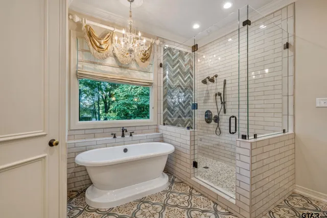 a bathroom with a sink a mirror and a shower