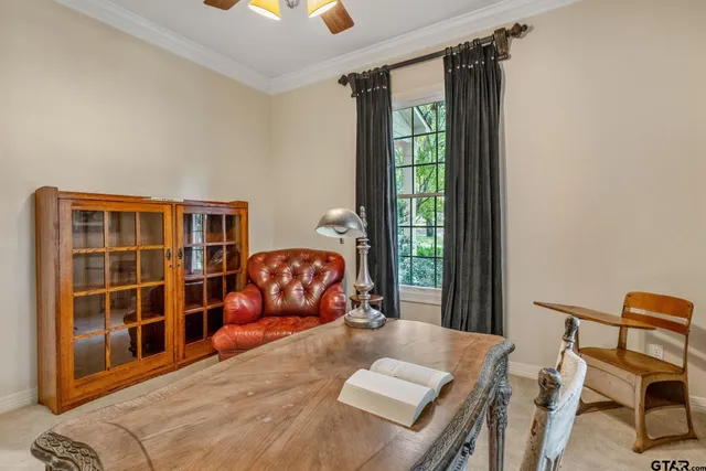 a bedroom with furniture and a window