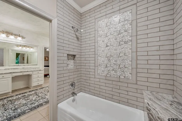 a bathroom with a bathtub and a shower