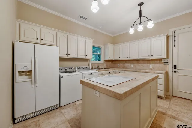 a view of a porch with furniture and garden