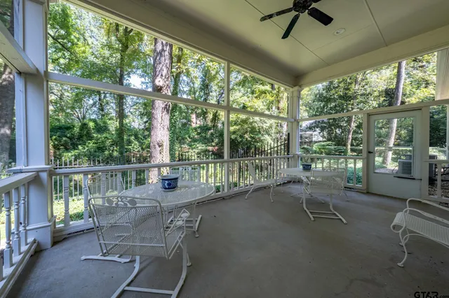 a balcony with wooden floor and outdoor space