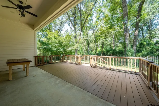 a swimming pool with outdoor seating and yard