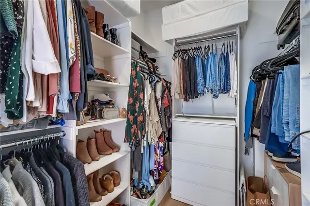 a bathroom with a granite countertop sink mirror and a bathtub
