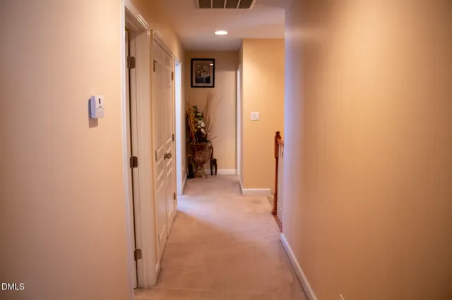 a view of a hallway with a room