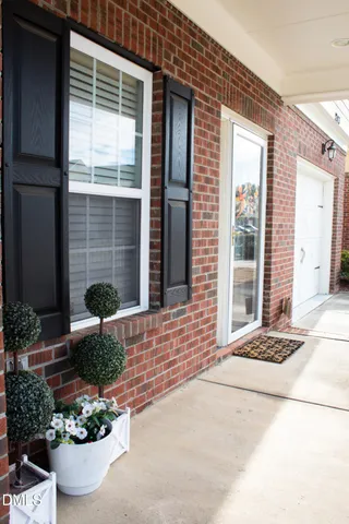 a view of a entryway door front of a house