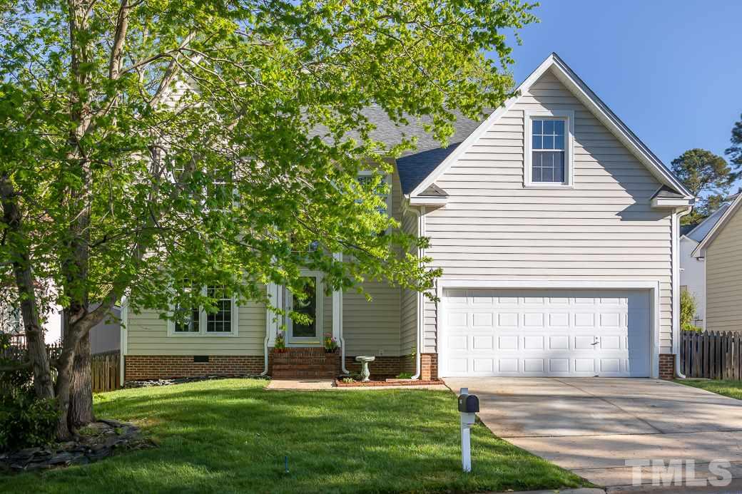 5608 Edgebury Road Raleigh, NC 27613 - Photo 1 of 11 a front view of a house with a yard and a garage