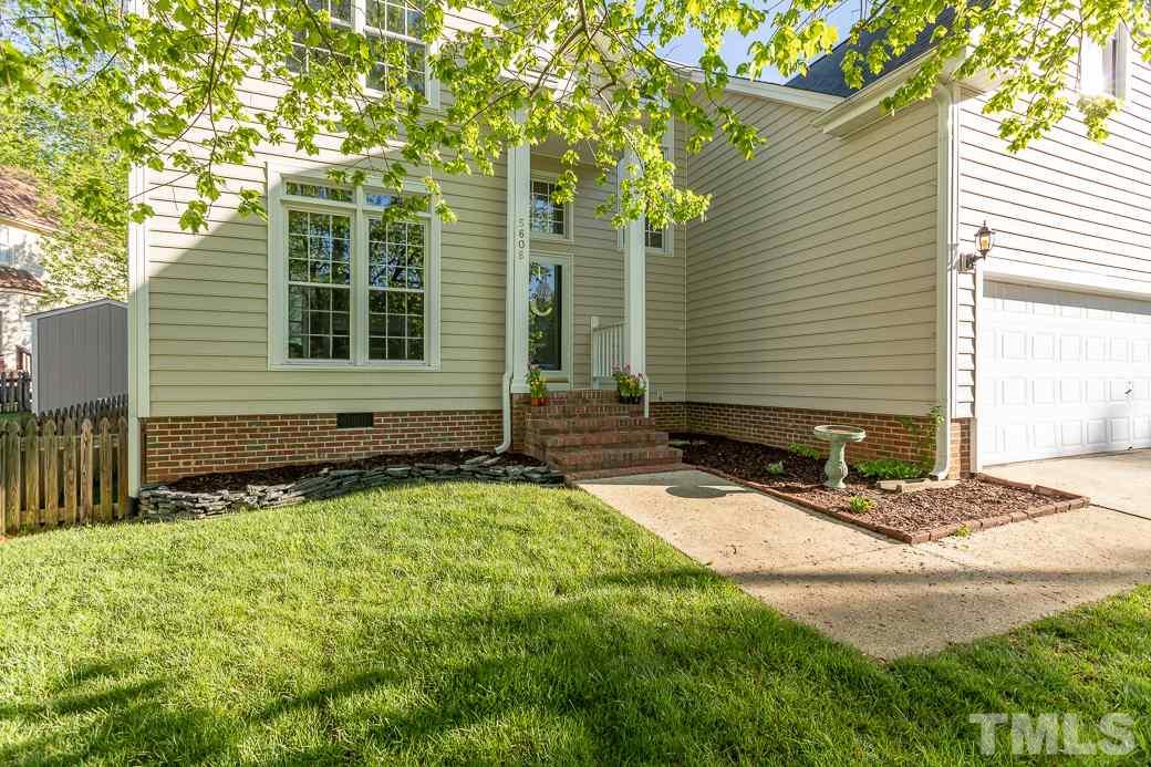 5608 Edgebury Road Raleigh, NC 27613 - Photo 2 of 11 a front view of a house with garden