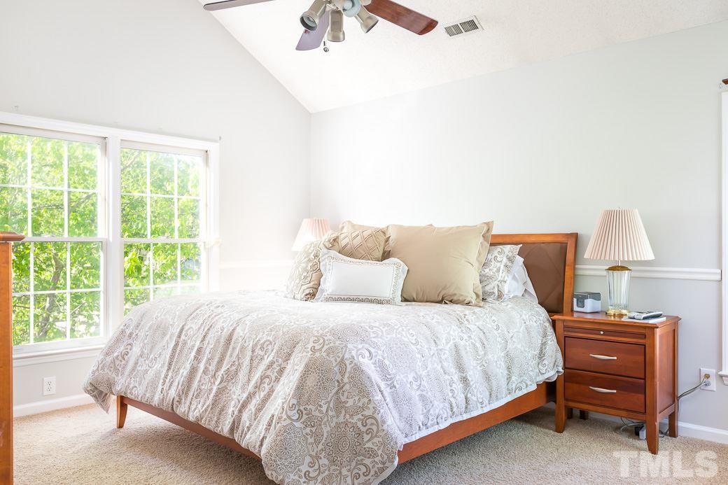 5608 Edgebury Road Raleigh, NC 27613 - Photo 8 of 11 a bedroom with a bed and window