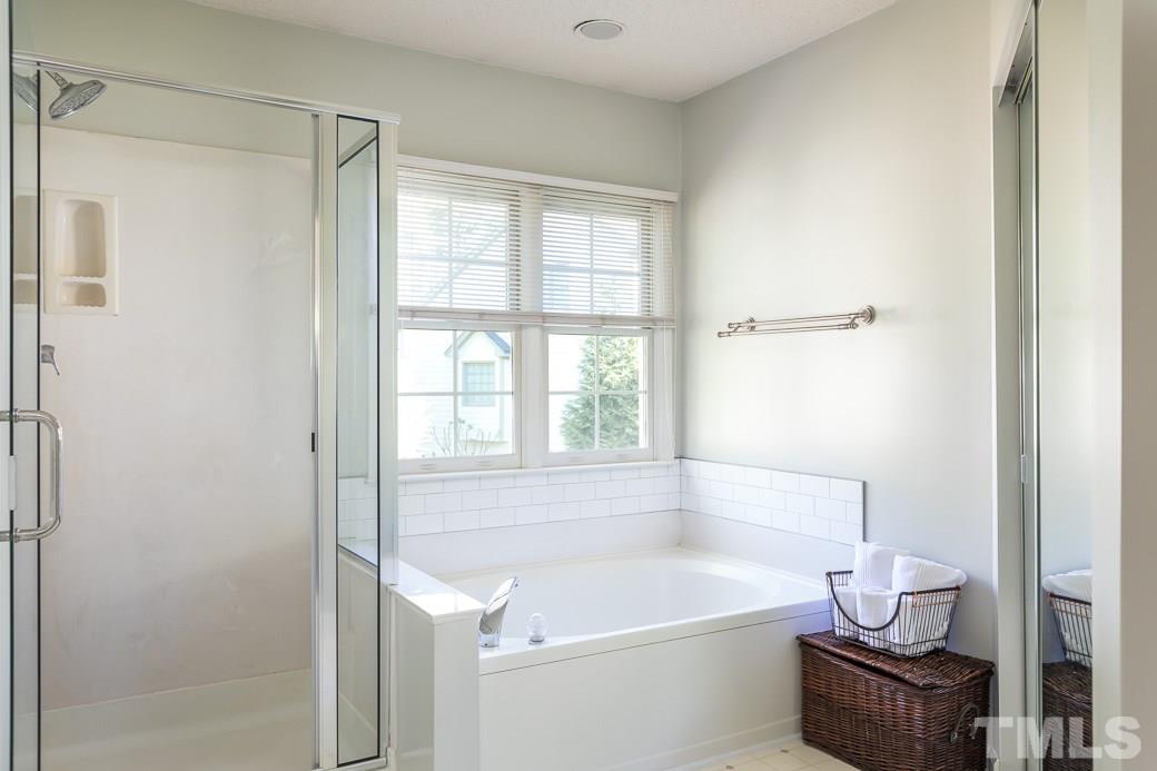 5608 Edgebury Road Raleigh, NC 27613 - Photo 10 of 11 a white bath tub sitting next to a white sink