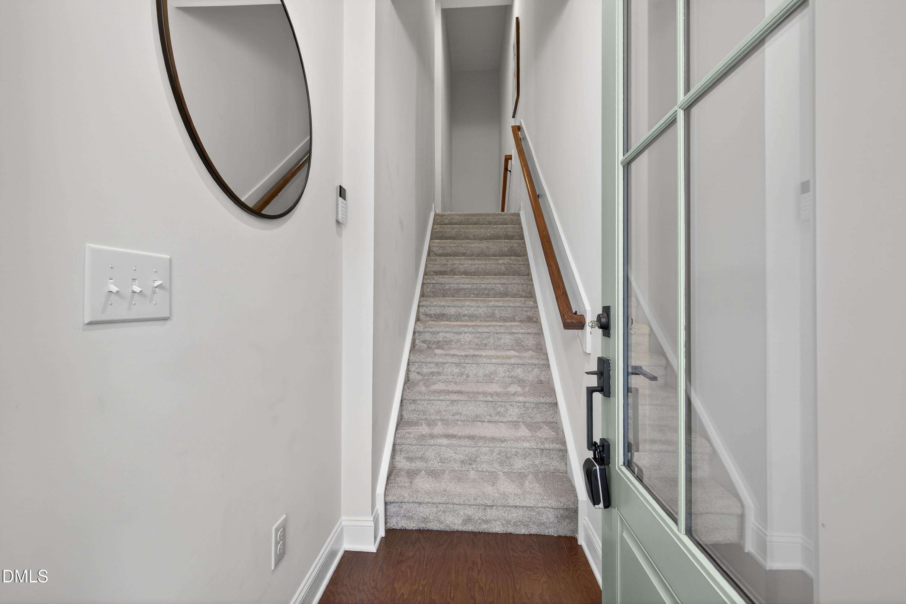 1063 Danvers Loop Apex, NC 27523 - Photo 4 of 67 a view of a hallway with wooden floor and entryway