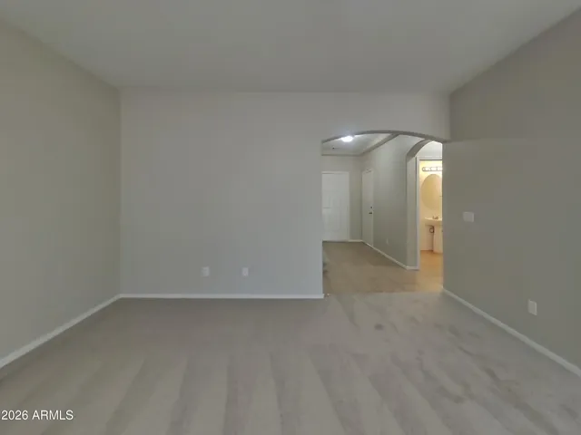 a kitchen with a refrigerator and a sink