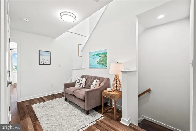 a bedroom with a large bed and a large window