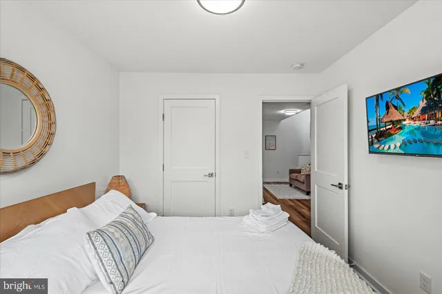 a room with a couch and wooden floor