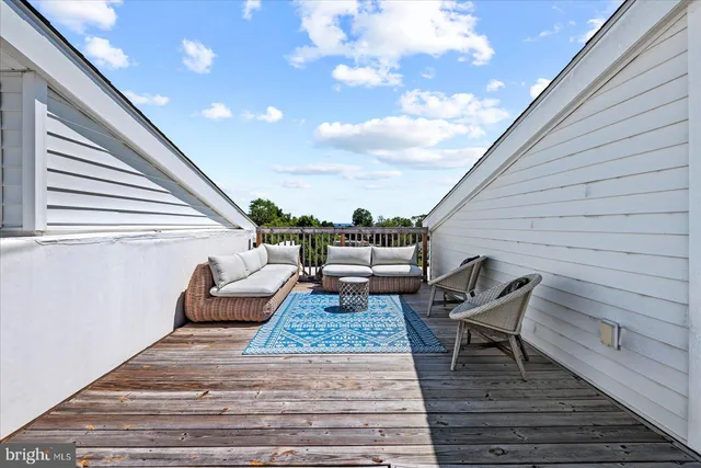 a view of a patio with two couches and deck