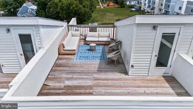 a view of a house with swimming pool and sitting area