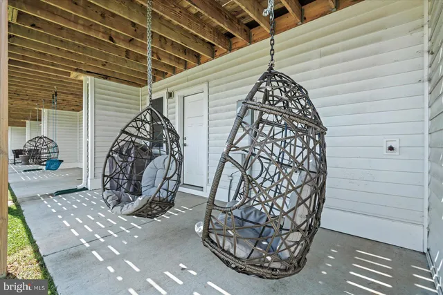 an aerial view of multiple houses with yard