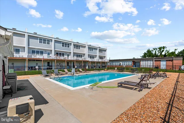 a view of a large building with a big yard and large trees