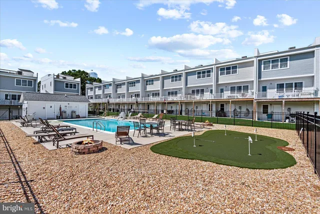 a view of a swimming pool with a garden