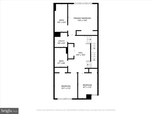 a picture of a bench in front of a wall