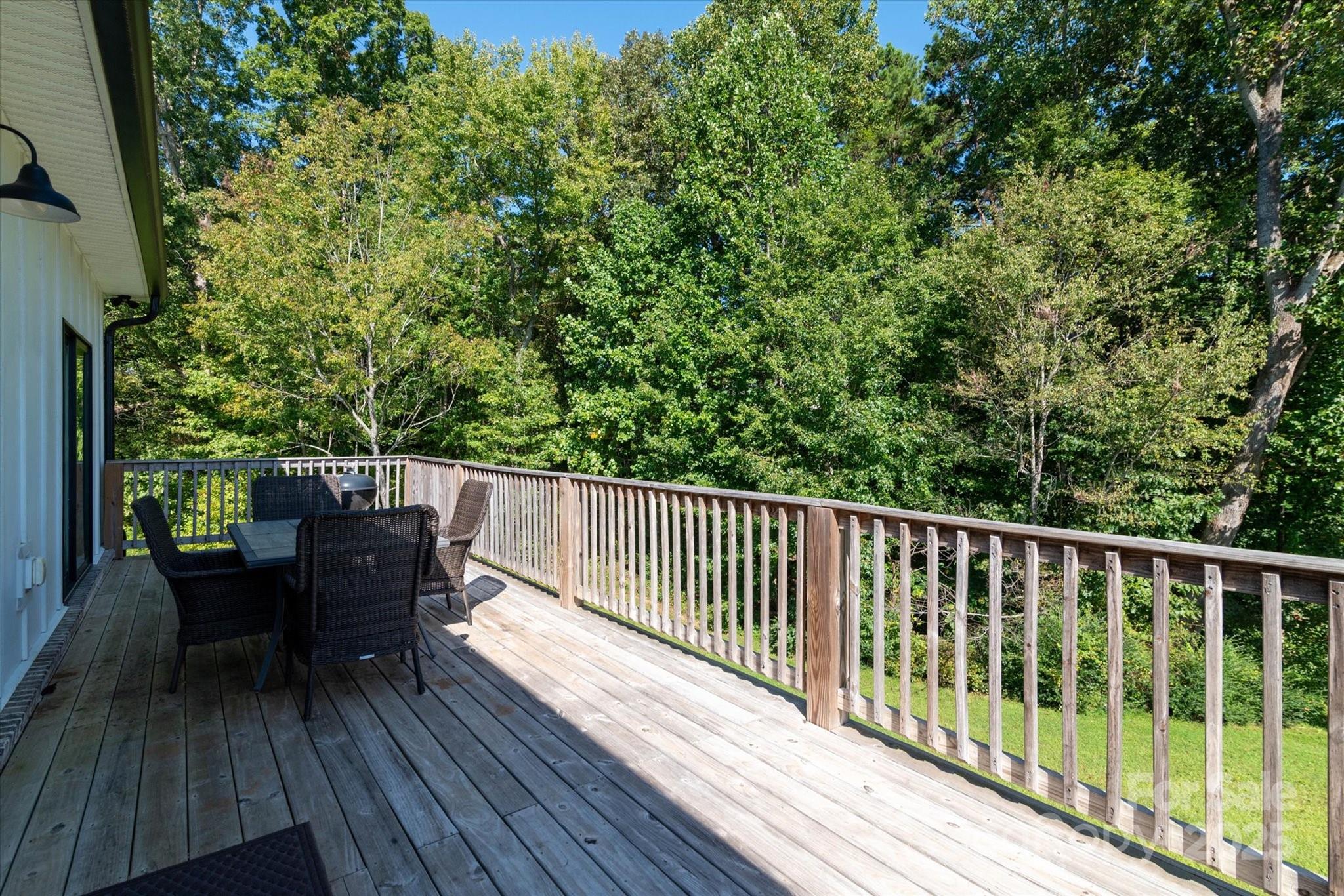5345 Christopher Road Iron Station, NC 28080 - Photo 12 of 48 a view of balcony with furniture and wooden floor